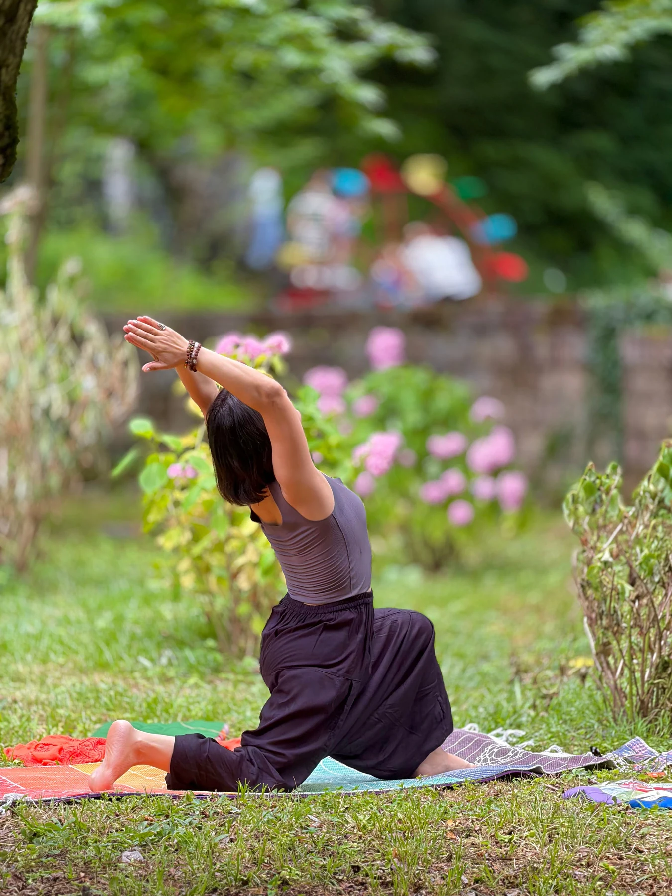 Gentle yoga and movement in a sunlit garden